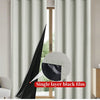 Single layer black film curtain in light gray blocking natural light through a window.