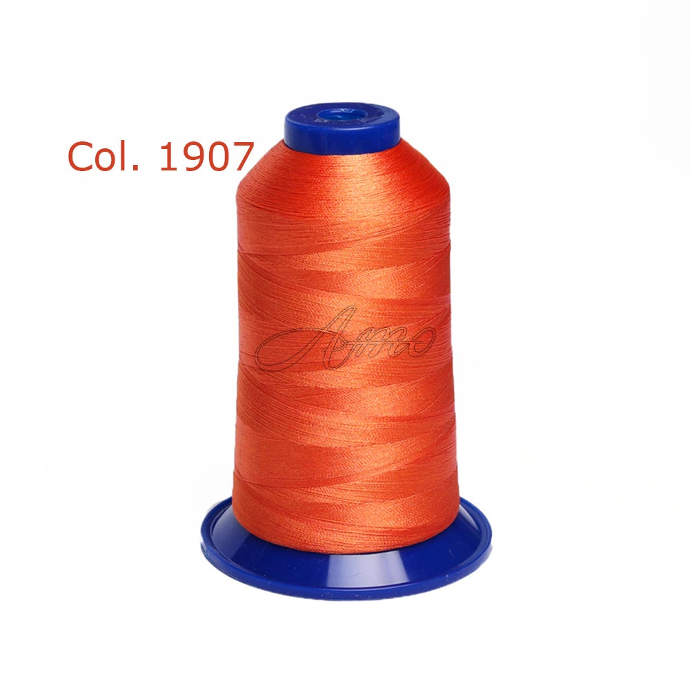 A spool of bright orange embroidery thread labeled Col. 1907