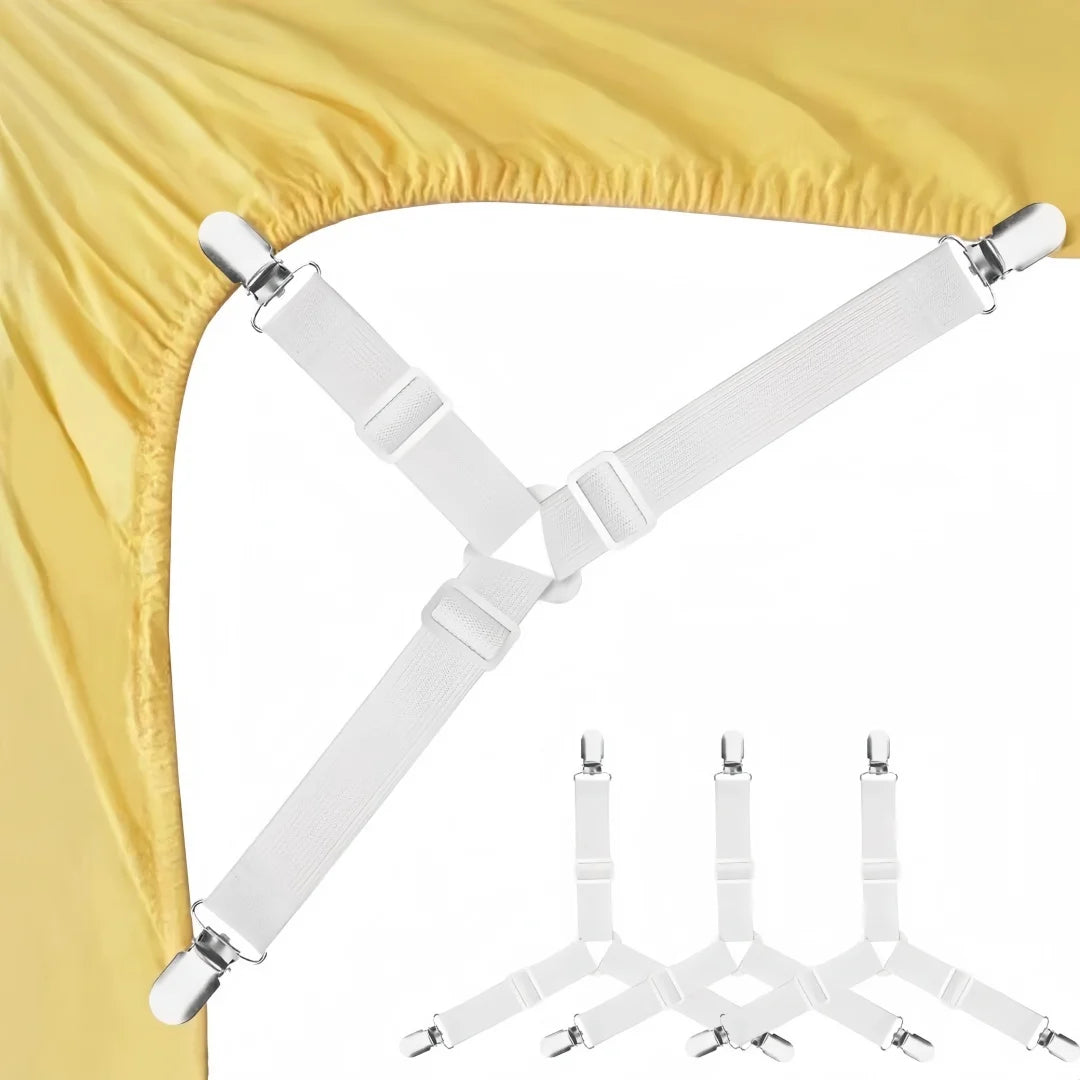 A set of white adjustable triangle bed sheet clips used to secure fabric, shown against a yellow curtain.
