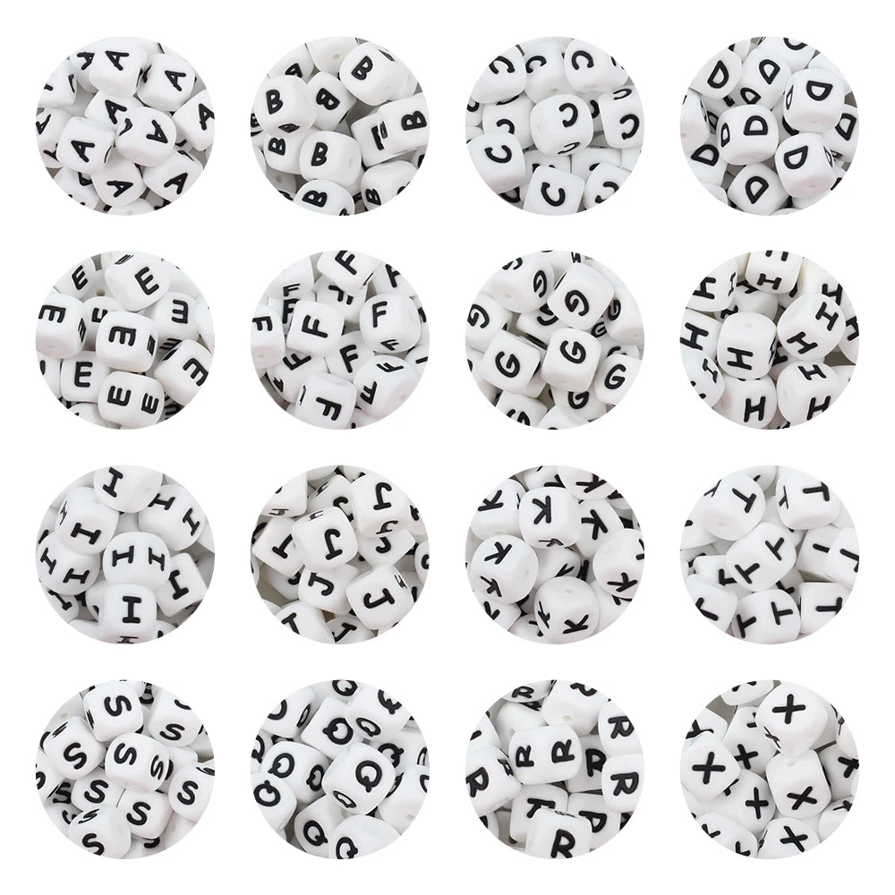 A collection of white silicone alphabet beads in various letters and symbols for DIY jewelry and crafts.