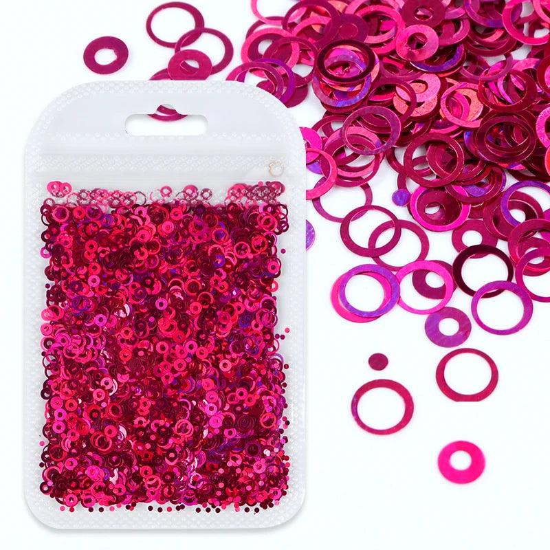 A white plastic container filled with bright pink and magenta glitter filler for epoxy art