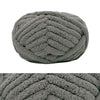 A close-up of a hand-knitted wool finger line scarf in a textured gray knit.