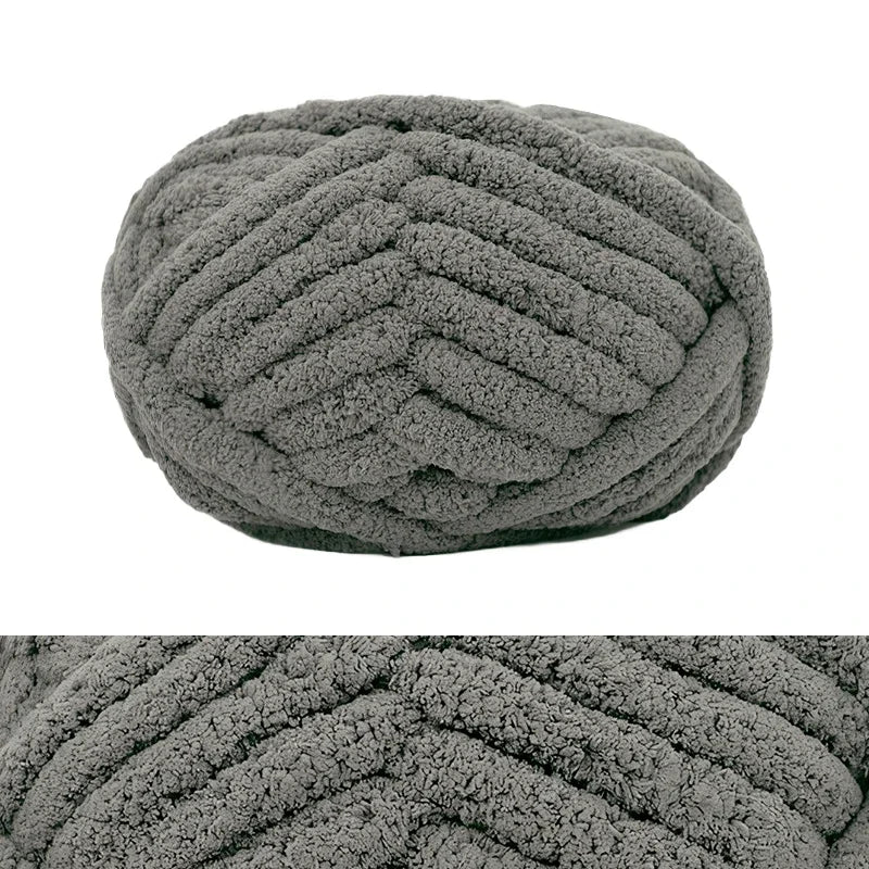 A close-up of a hand-knitted wool finger line scarf in a textured gray knit.