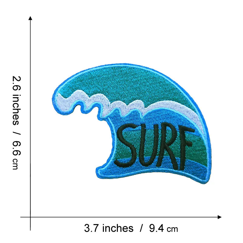 A teal and blue embroidered patch shaped like a breaking wave with the word SURF on it.