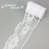 White decorative lace ribbon roll with a white fabric tip and floral pattern