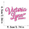 Pink embroidered iron-on clothing patches spelling out Victoria Lynn Jewelry