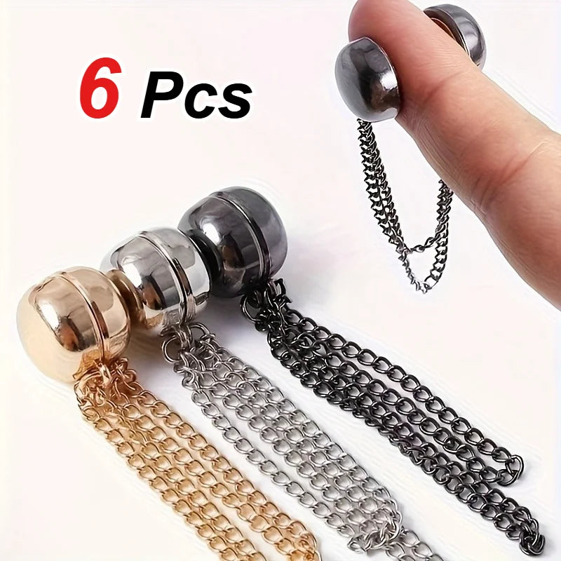 Six magnetic clothing adjustment buttons in gold, silver, and black metal chains.