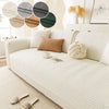A cream fabric sofa cushion cover with a chevron pattern and various round fabric swatches.