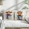 A decorative pillow cover featuring a print of an adorable Highland cow with floral accents.