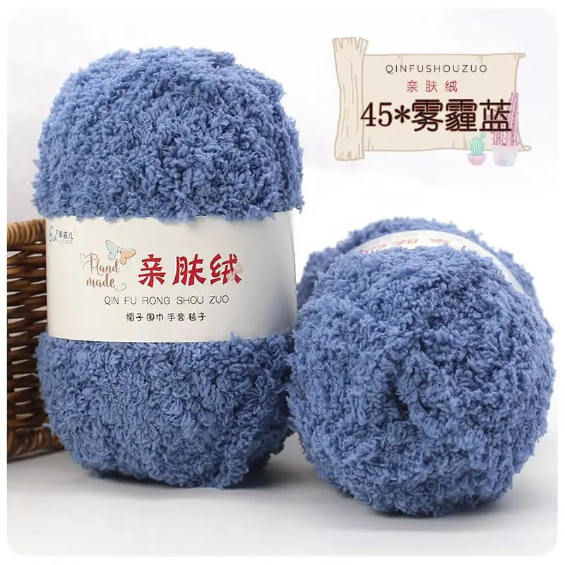 A ball of soft blue coral velvet yarn labeled as Qinfushouzuo for crafting
