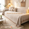 A beige chenille blanket featuring a fishbone pattern used as a cat scratch prevention product on a sofa.