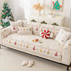 A beige sofa seat covered with festive Christmas-themed fabric featuring pine trees and ornaments.