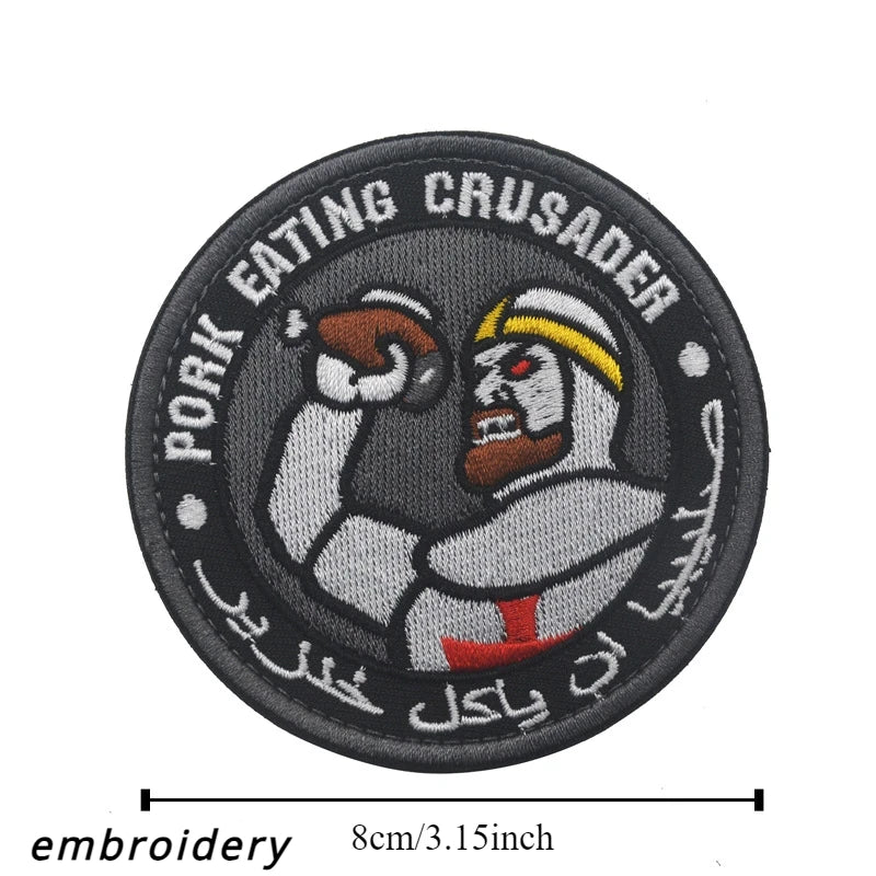 Black embroidered patch featuring a stylized figure with a beard and helmet surrounded by text.