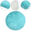 A round, light blue shaggy area rug shown with close-ups of its texture and fibers.