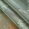 Gray floral lace tablecloth featuring a tatting weave texture.