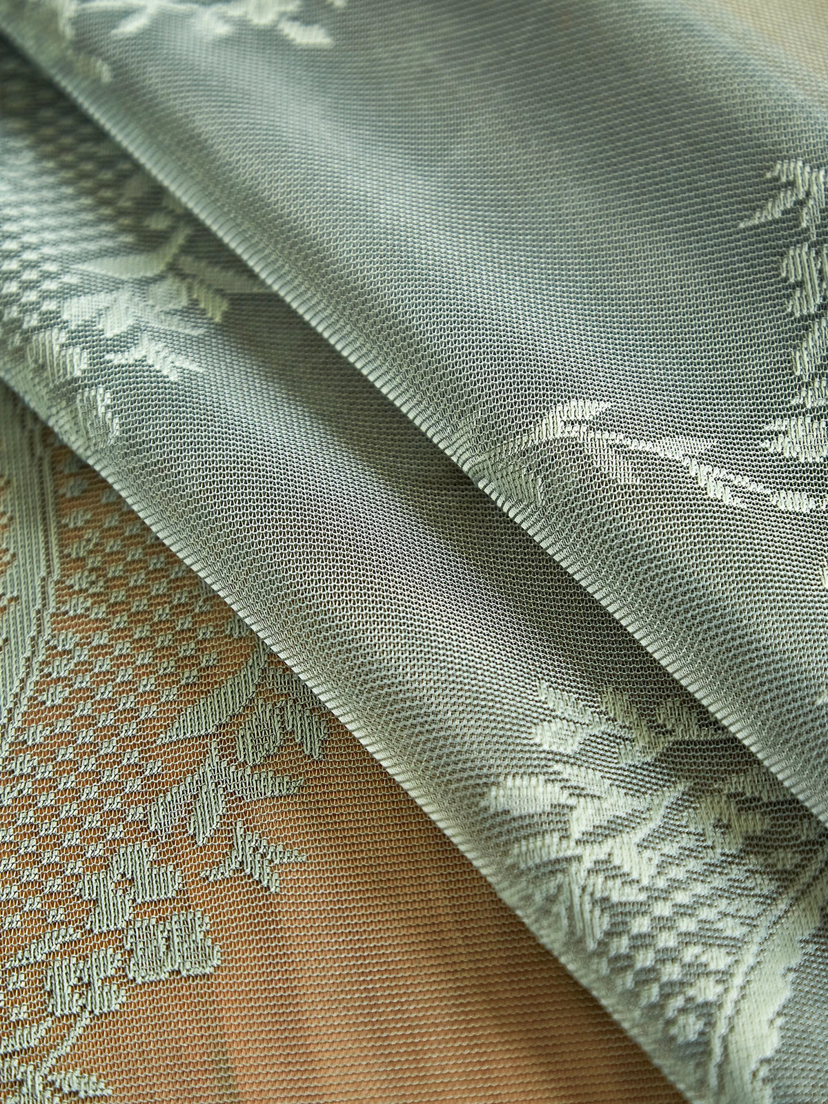 Gray floral lace tablecloth featuring a tatting weave texture.