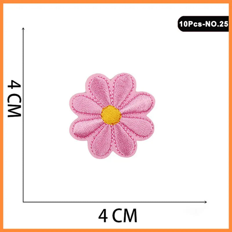 A set of 10 pink and yellow embroidered flower patches for iron-on use.