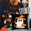 A set of black pillow covers featuring Halloween themes like pumpkins and ghosts against a spooky background.