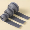 Rolls of gray self-adhesive hem tape for fabric repair and shortening