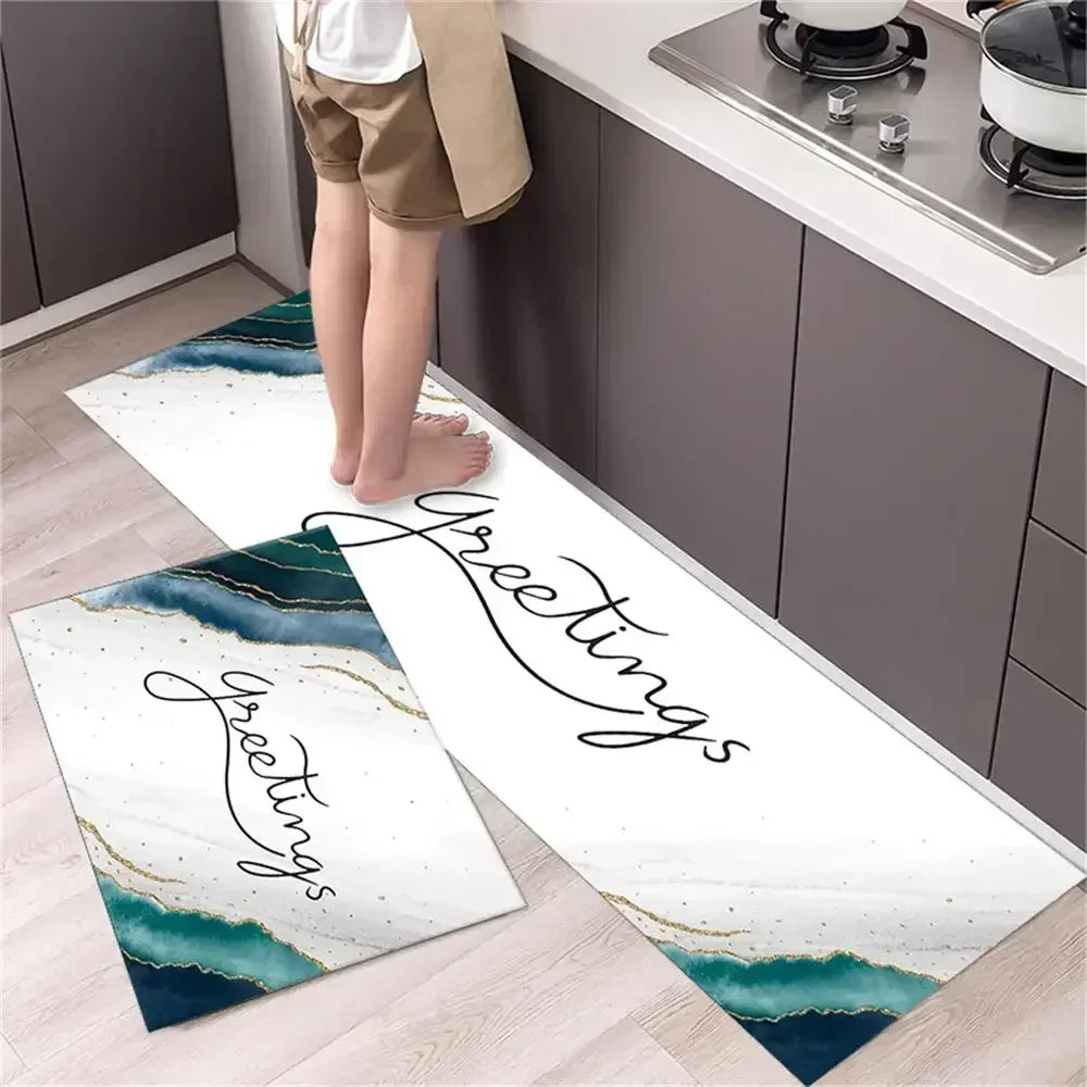 Two rectangular non-slip kitchen rugs with a diamond print featuring elegant script lettering on a white background.