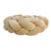Handmade knotted floor mat for bed decor made of light beige or tan fabric