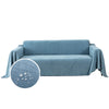 A light blue waterproof sofa cover blanket draped over a piece of furniture.