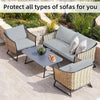 Gray outdoor sofa cushions and seating covers made of woven wicker material placed on a patio.