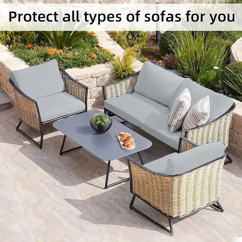Gray outdoor sofa cushions and seating covers made of woven wicker material placed on a patio.