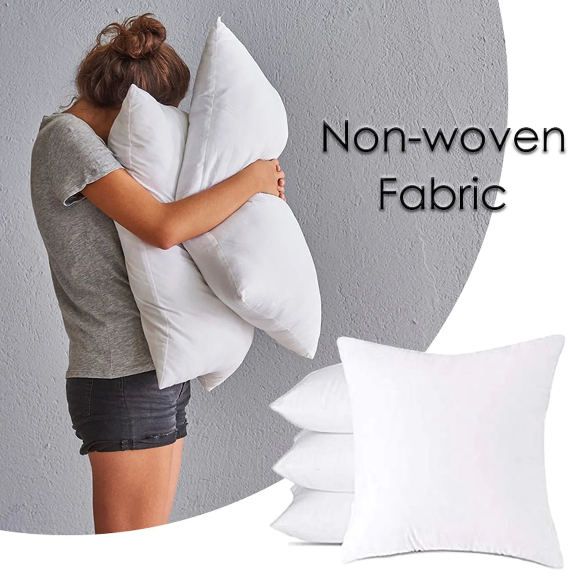 A woman is hugging a large white pillow against a gray wall, demonstrating the soft cotton-padded headboard cushion.