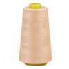 A roll of light beige sewing thread with a yellow core and plastic spool.