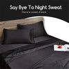 A black satin pillow cover is displayed on a bed with a dark gray duvet and a book.