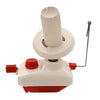 A white hand operated wool yarn winder with a cylindrical spindle and a metal rod.