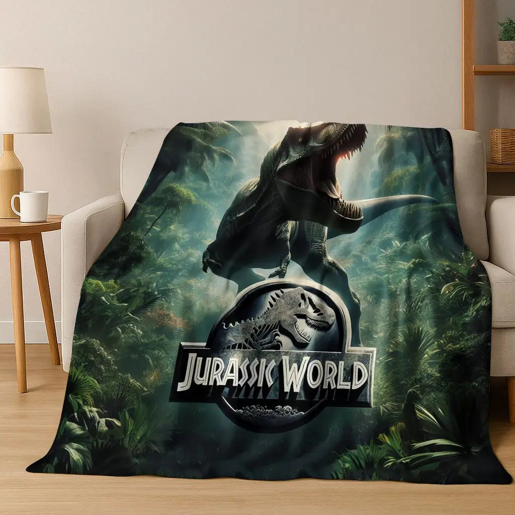 A dark green and brown Jurassic World dinosaur graphic blanket featuring a T-Rex silhouette.