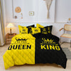 A yellow and black duvet set featuring crown print bedding for a couple.