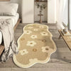 Irregular plush cream area rug with scattered floral patterns on a light wood floor.