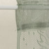 Translucent sun and moon lace door curtain draped over a white rod.