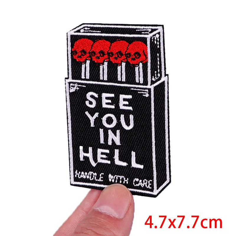 Black embroidered patch with red skulls and the text SEE YOU IN HELL HANDLE WITH CARE