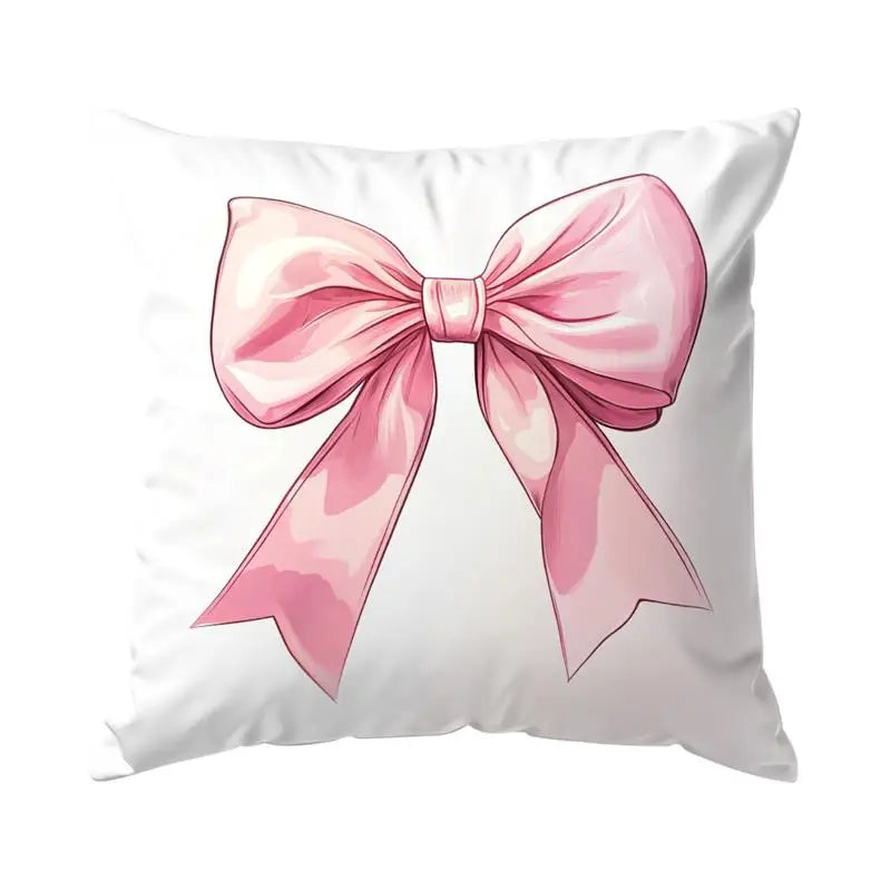 A decorative pillow cover featuring a pink bow pattern.