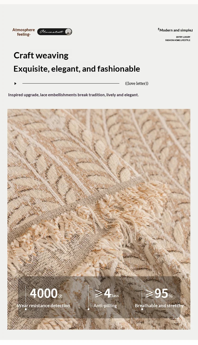 Close-up of a beige and cream textured fabric showing herringbone weave detail.