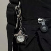 Silver star-shaped pocket watch keychain attached to a black fabric strap.