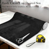 Black suede auto headliner fabric roll next to a pair of scissors for cutting