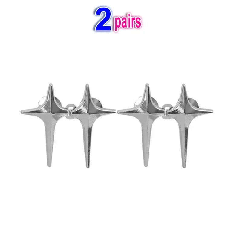 A pair of silver Y2K star clips for fastening jeans and skirts.