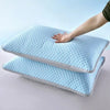 A hand is placing a light blue ice silk cooling pillowcase onto another folded pillowcase.