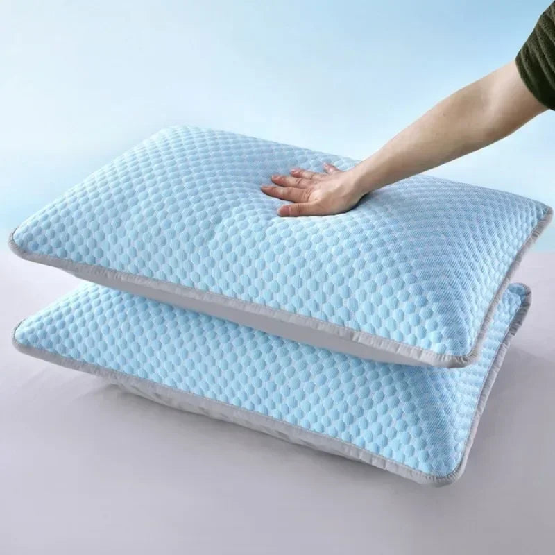 A hand is placing a light blue ice silk cooling pillowcase onto another folded pillowcase.