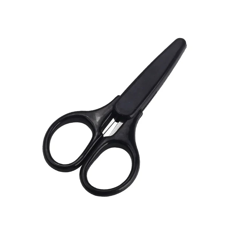 A pair of black precision craft scissors with a protective cap.