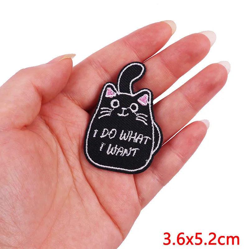 Black embroidered iron-on patch of a cat saying I do what I want