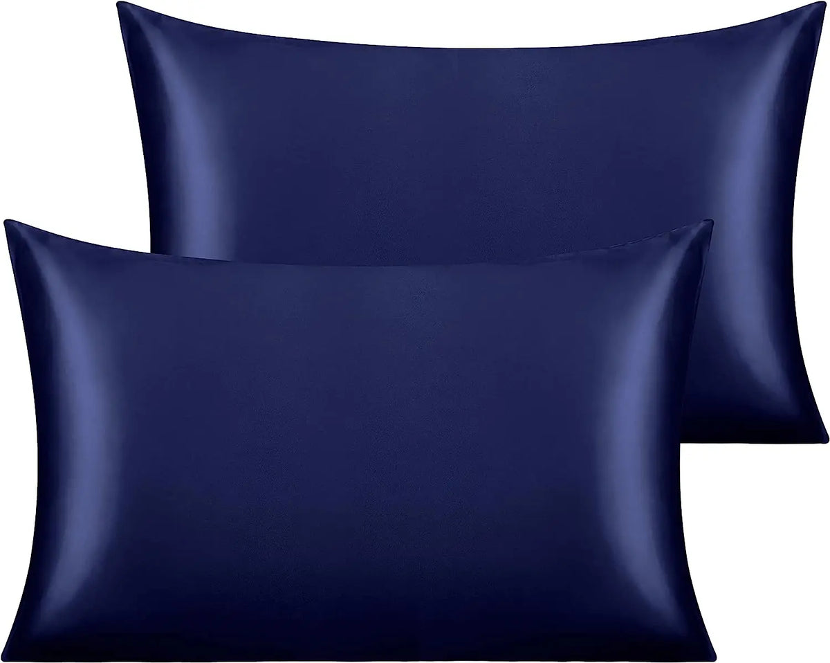 A set of two navy blue silky satin toddler pillowcases.