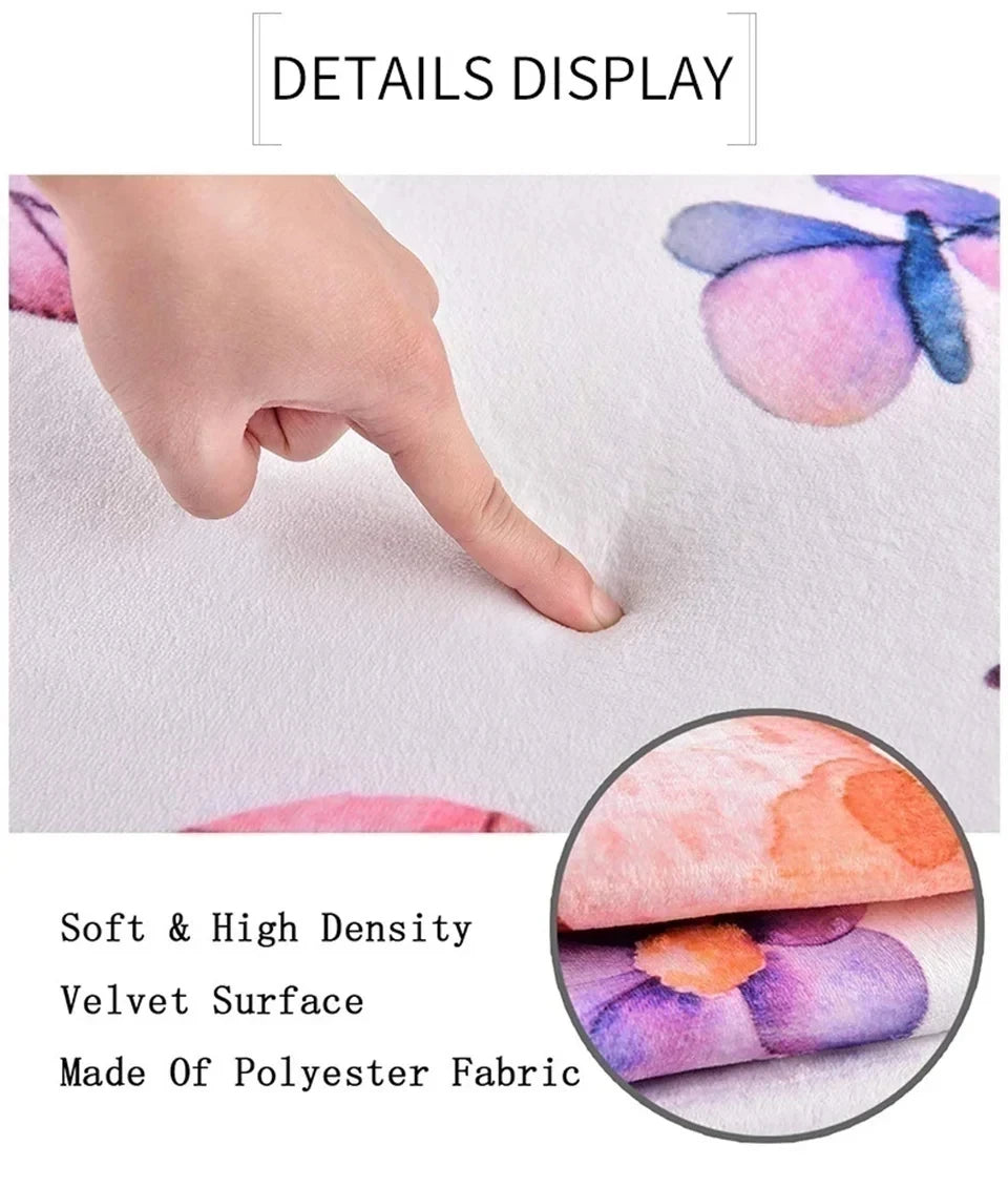 Close-up display of a soft velvet polyester fabric welcome mat featuring floral designs and a butterfly detail.