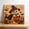 Diamond painting of a fluffy orange cat wearing a purple witch hat and holding a pumpkin basket on a canvas