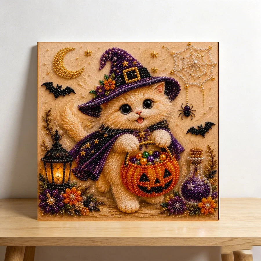 Diamond painting of a fluffy orange cat wearing a purple witch hat and holding a pumpkin basket on a canvas